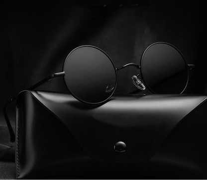 Black round sunglasses on a dark surface with 'Ruo Bo' branding.