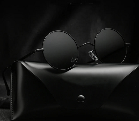 Black round sunglasses on a dark surface with 'Ruo Bo' branding.