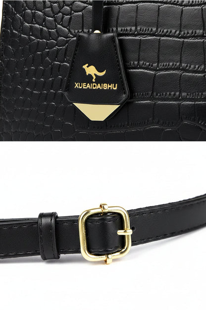 Black belt with gold buckle and logo on a gray background